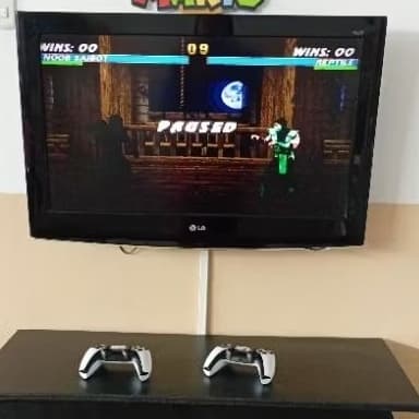 vídeo game nostalgia M15 game stick 64gb com 2 controles sem fio + 20 mil jogos game sensação( envio rapido)