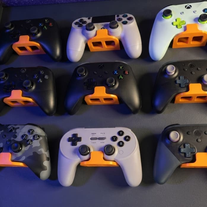 Kit 2 Suportes de Parede para Controle de Videogame Universal Compatível PS5 - PS4 - XBOX - NINTENDO