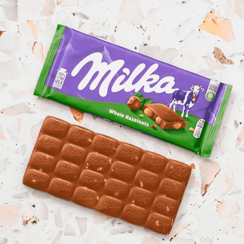 Chocolate ao leite com avelã inteira Milka Importado 95g