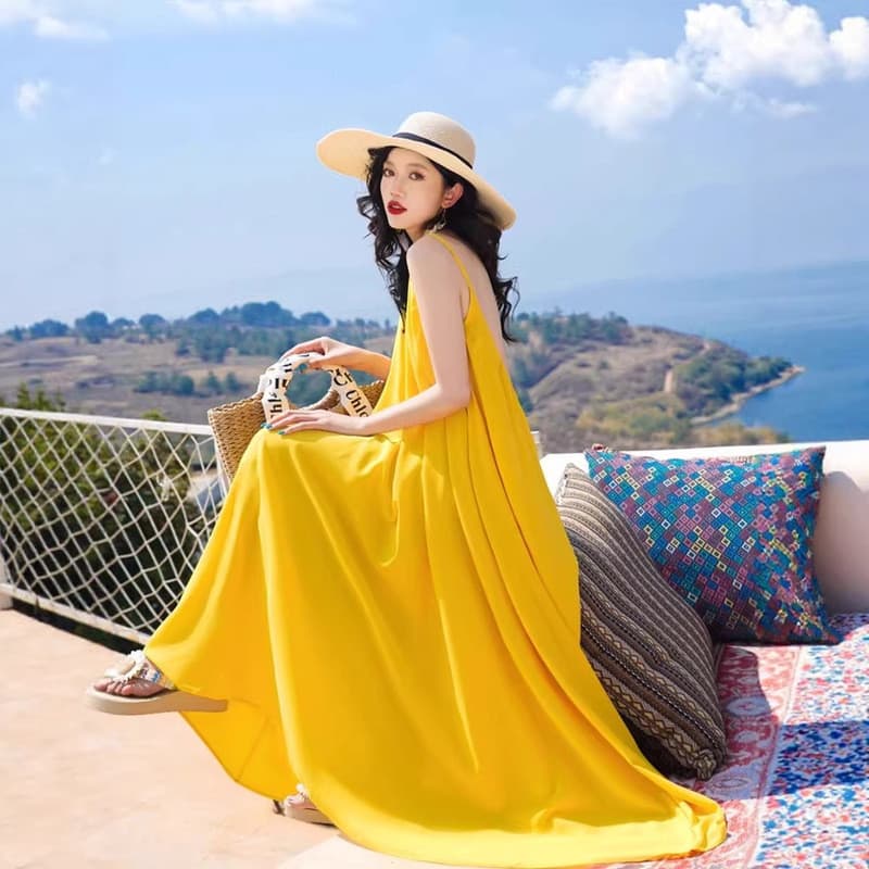 Foto vestido de praia High-End feminino verão Super fada Halter vestido longo férias à beira-mar vestido amarelo
