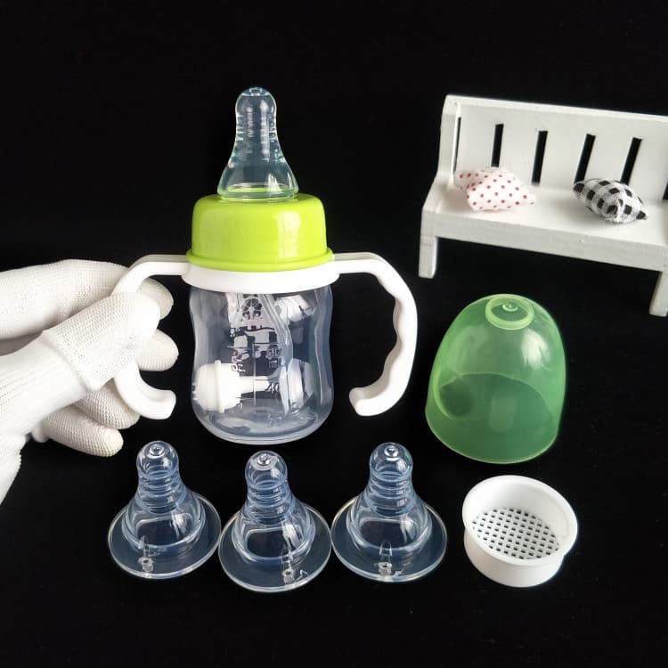 Bebê tamanho pequeno 60ml Mini plástico PP bebê beber suco de frutas garrafa de bebê padrão resistente a choques alça li
