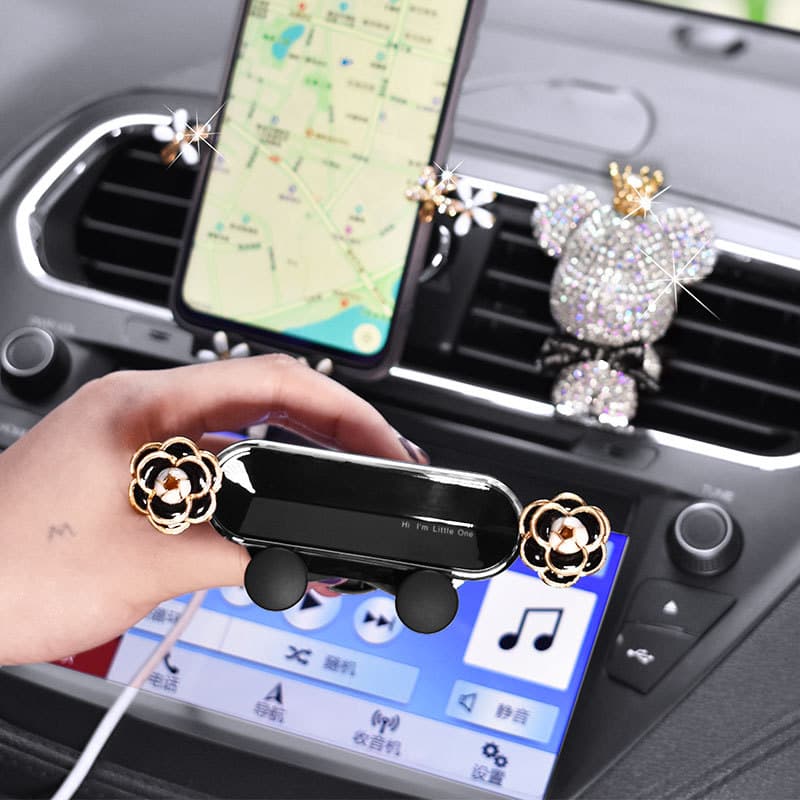 Novo bonito criativo suporte do telefone do carro feminino suporte de gravidade ventilação ar suporte do telefone móvel 