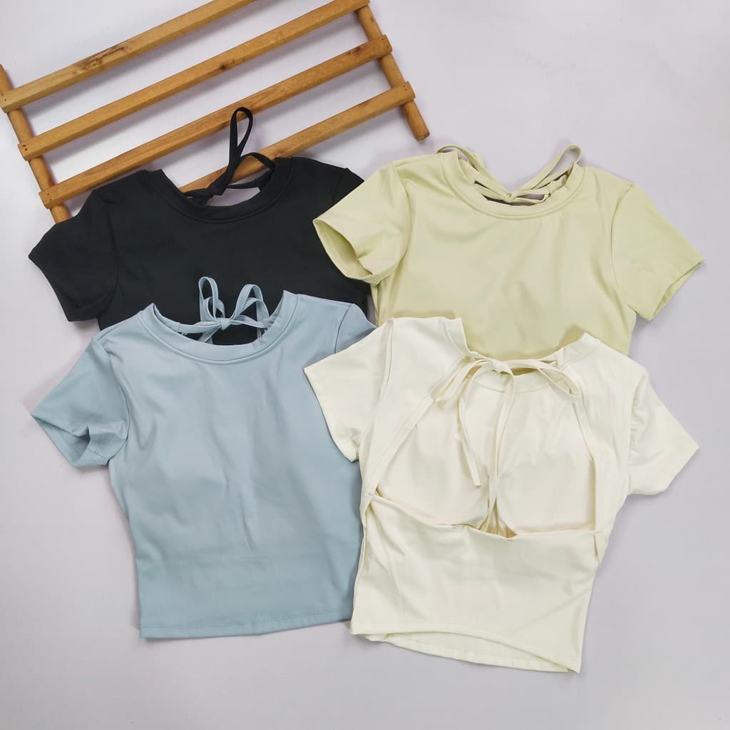 Uma linha Tether Yoga de manga curta feminina com almofada No peito bela volta sem usar roupa interior roupas de Fitness
