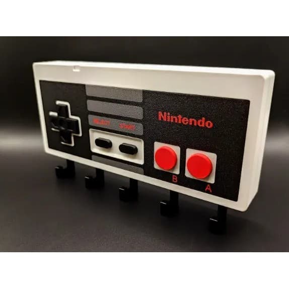 Decoração de Parede com Design de Controle de Videogame para Organizar Chaves